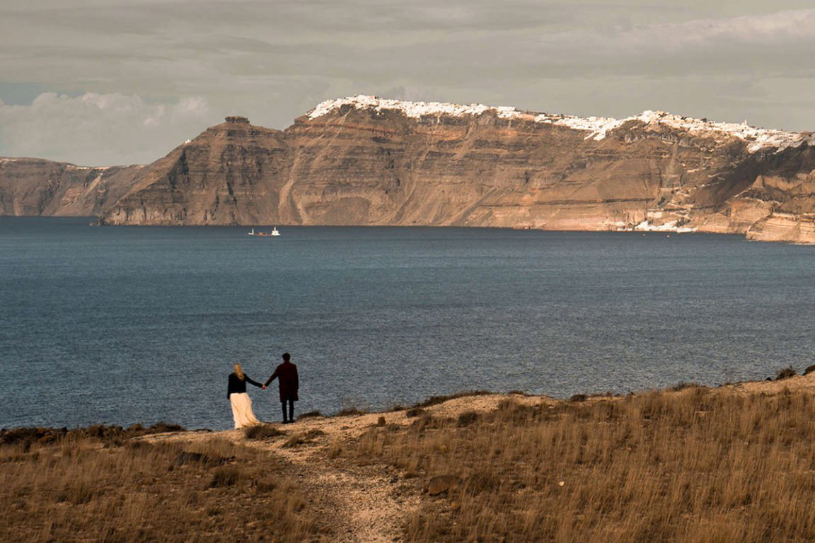 Couple standing in Akrotiri after their Santorini Adventurous elopement