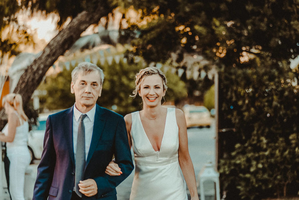 Athens Riviera Wedding Videographer filming ceremony in Lake Vouliagmeni