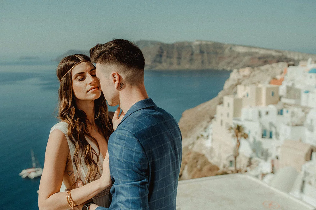 A couple elopement in Oia to illustrate the Best Wedding Venues in Santorini
