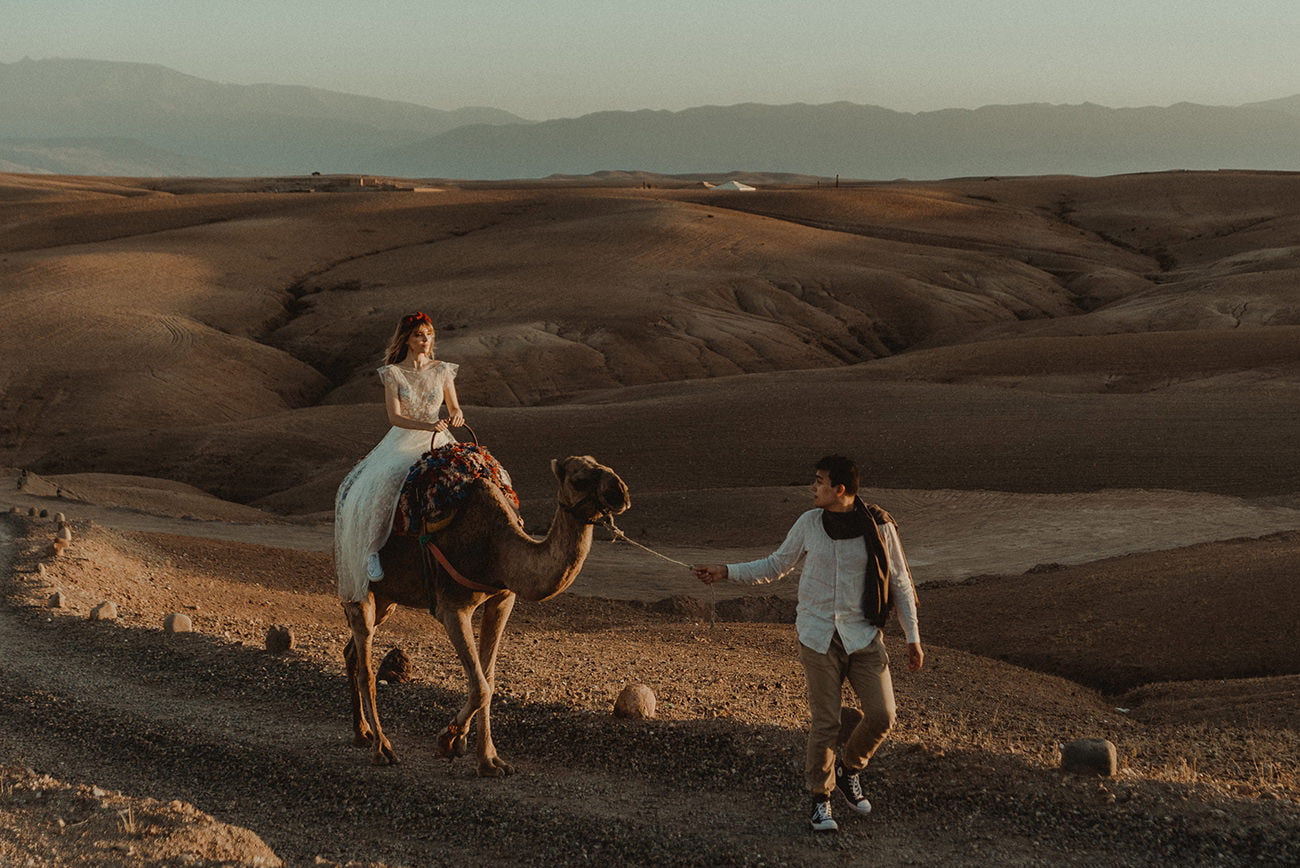 Morocco Elopement Wedding couple with a camel in the desert