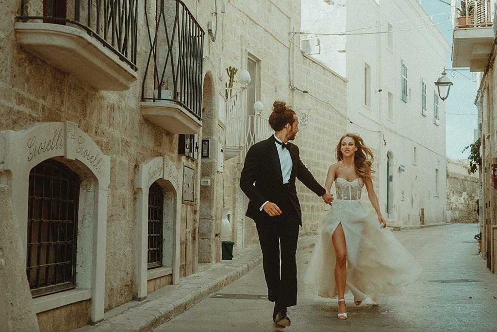Puglia Wedding Videographer Cinema of Poetry filming couple in Monopoli for their destination Wedding in Masseria Spina