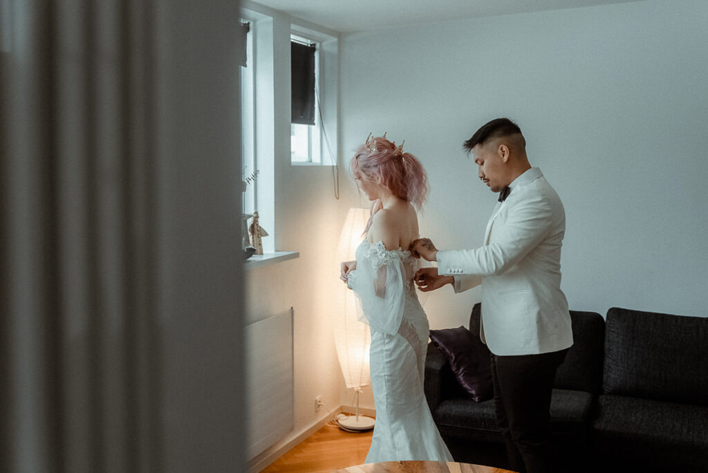 Couple getting ready for their winter wedding in Iceland