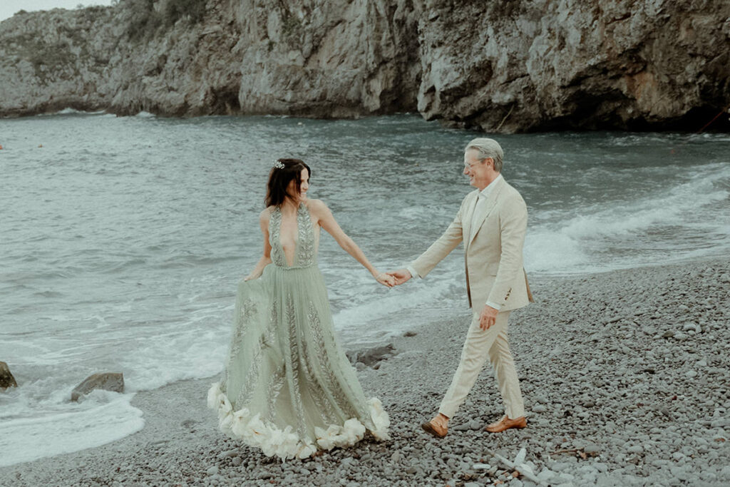 Couple walking in the shore in the Amalfi Coast