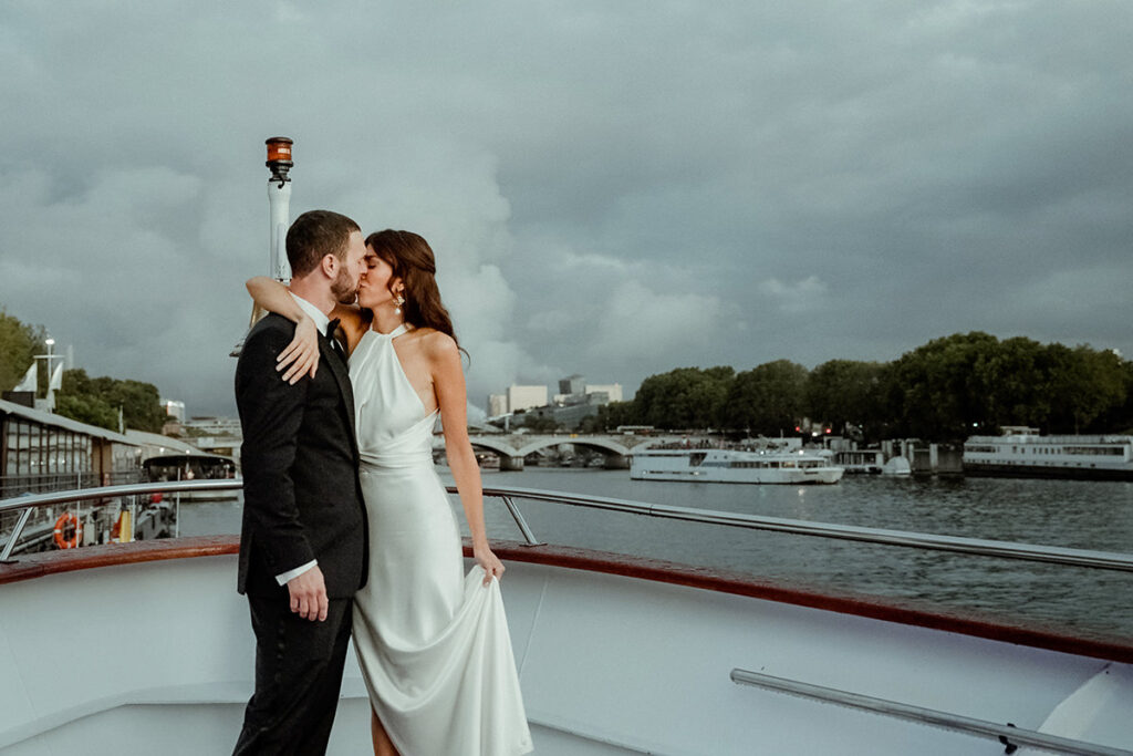 Videographer Cinema of Poetry filming an outdoors boat wedding in Paris