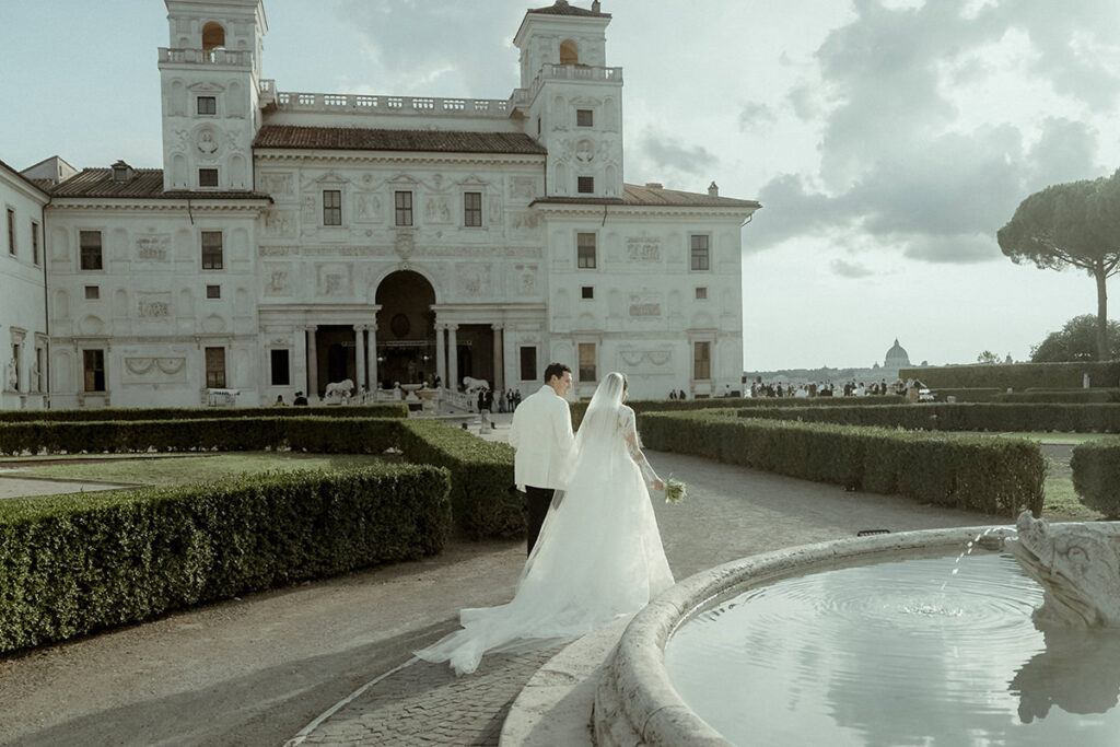 Best Wedding Videos of 2022: Couple in a vintage car in iconic Villa Medici in Rome