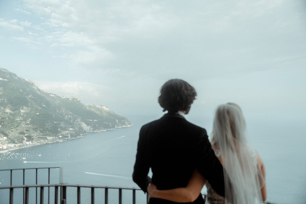 couple looking at the view of the sea after their intimate Wedding in Villa la Rondinaia