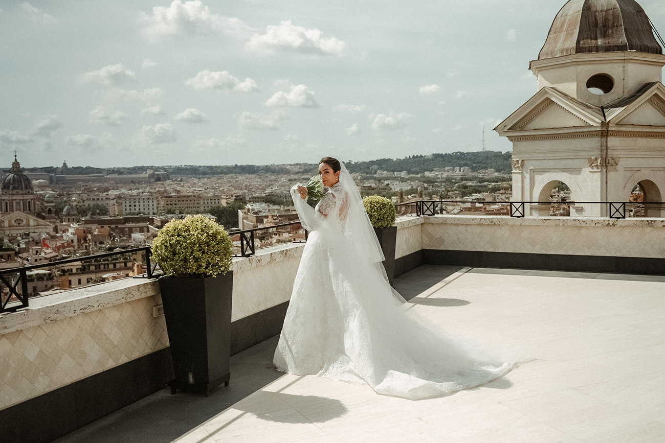 Beutiful Bride in her wedding dress on a rooftop in Rome