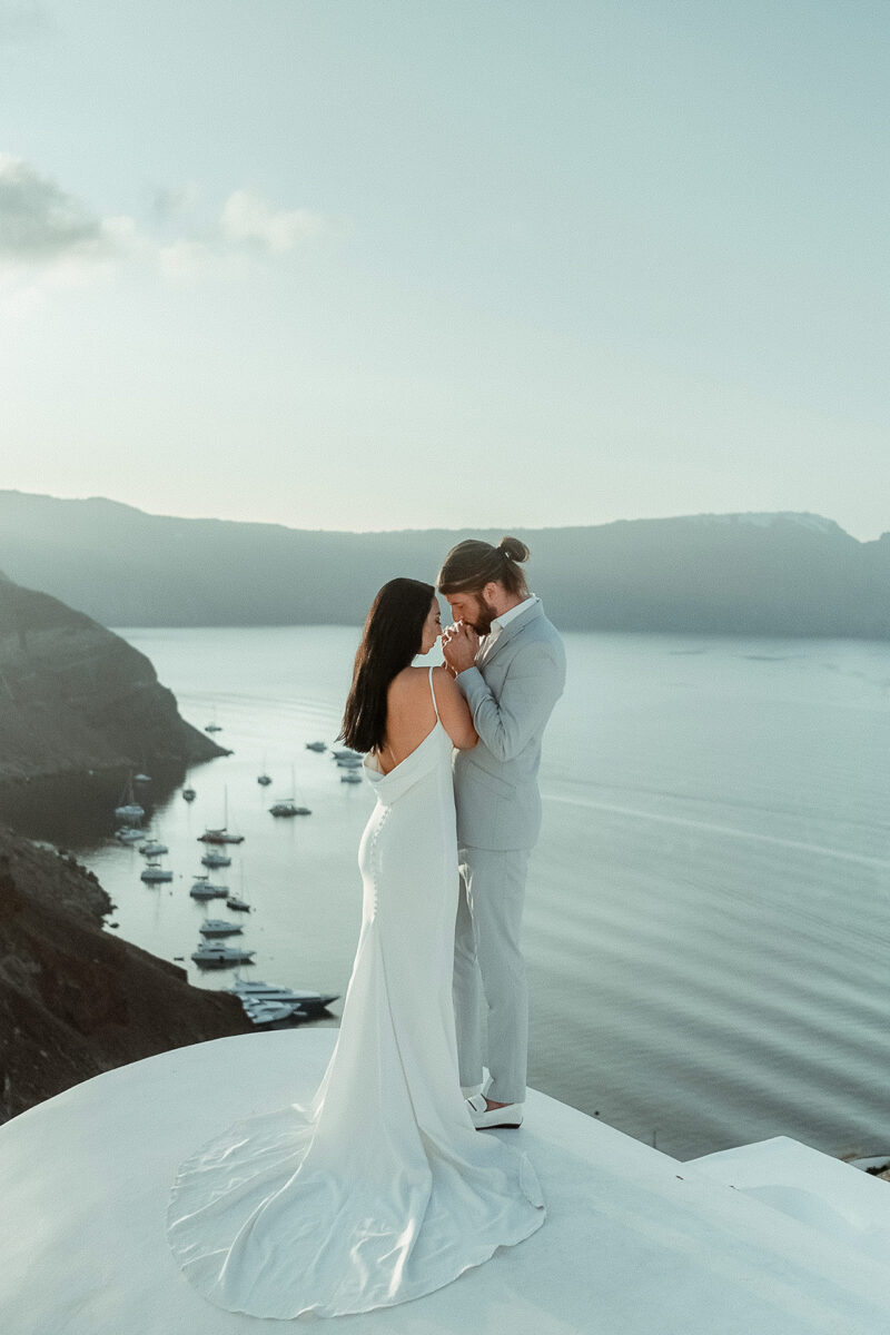 Destination Wedding Films in Greece Cover Picture featuring a couple in Santorini