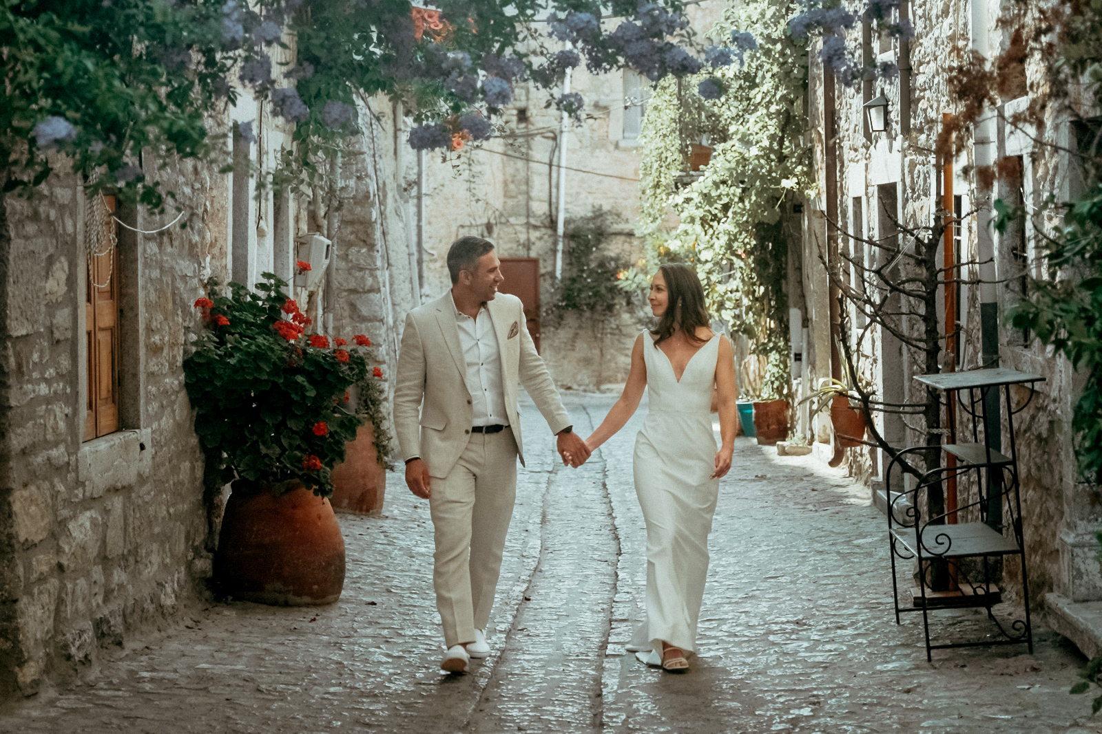 Couple walking in Mesta for a Greek Island wedding in Chios