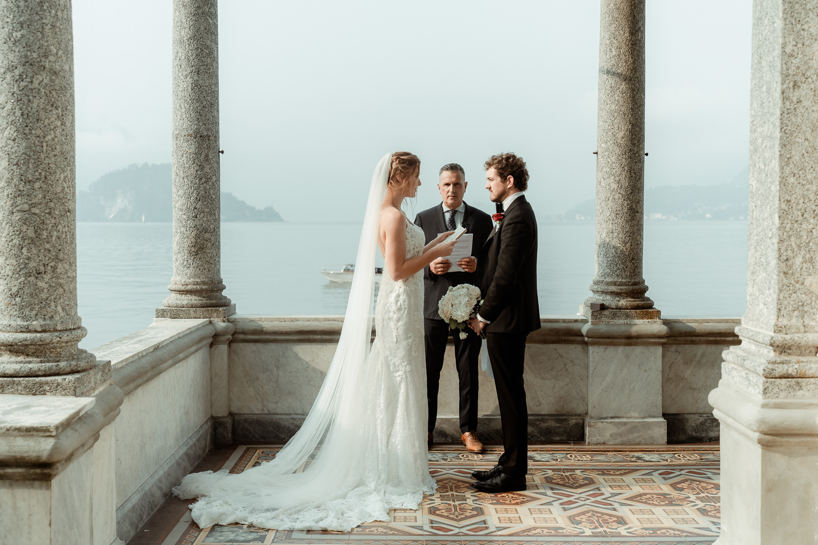 A Couple exchanging vows for an intimate Lake Como elopement at Villa Monastero