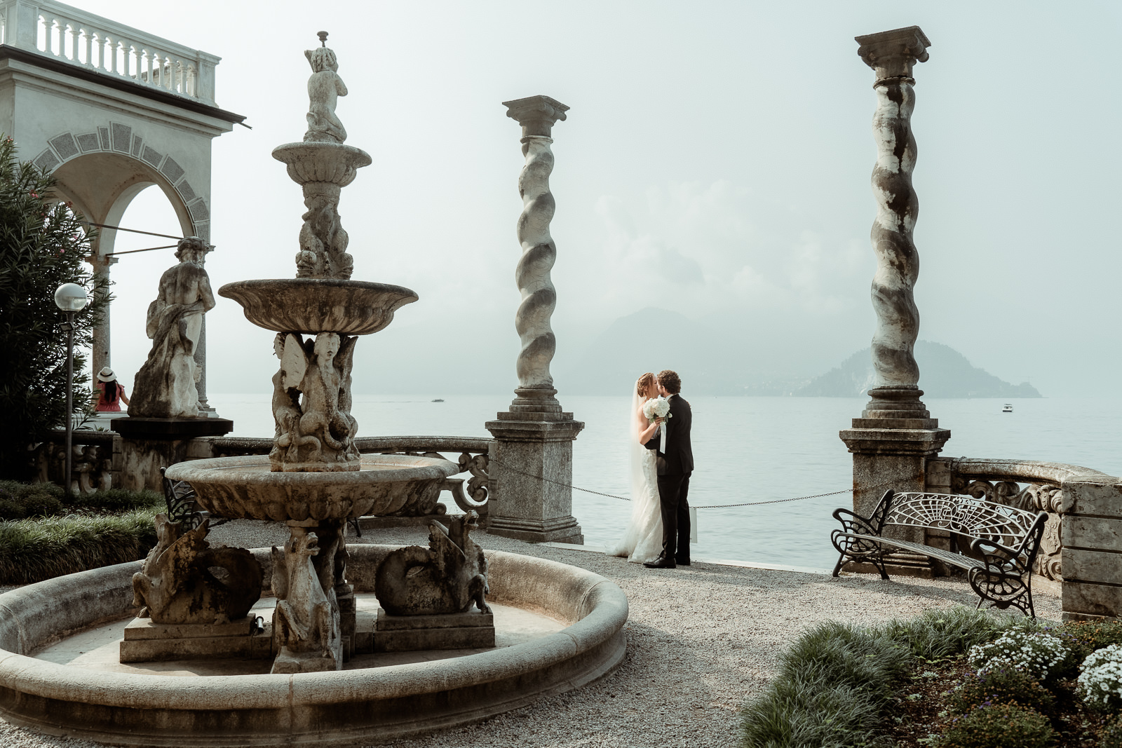 Couple Hugging in front of the waters after their Intimate Lake Como Elopement at Villa Monastero