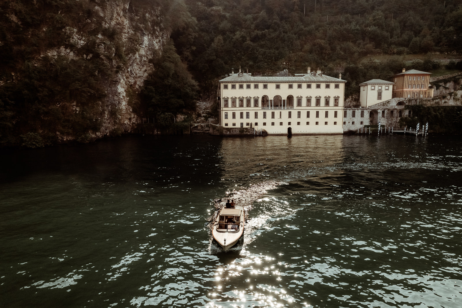 Aerial View of a boat with a couple after an Intimate Lake Como Elopement at Villa Monastero