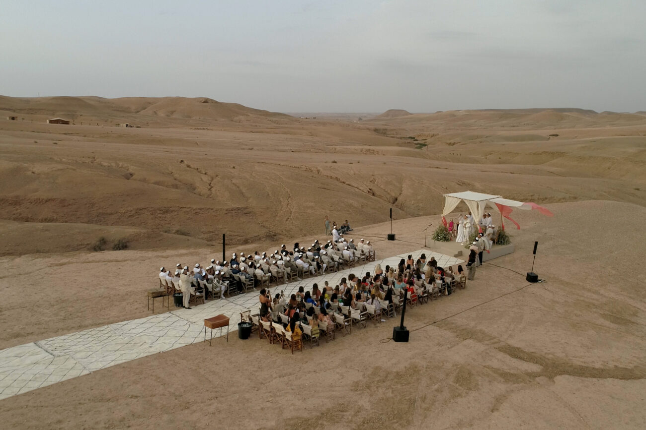 Wedding in Agafay Desert Scarabeo Camp filmed by a Morocco Wedding Videographer