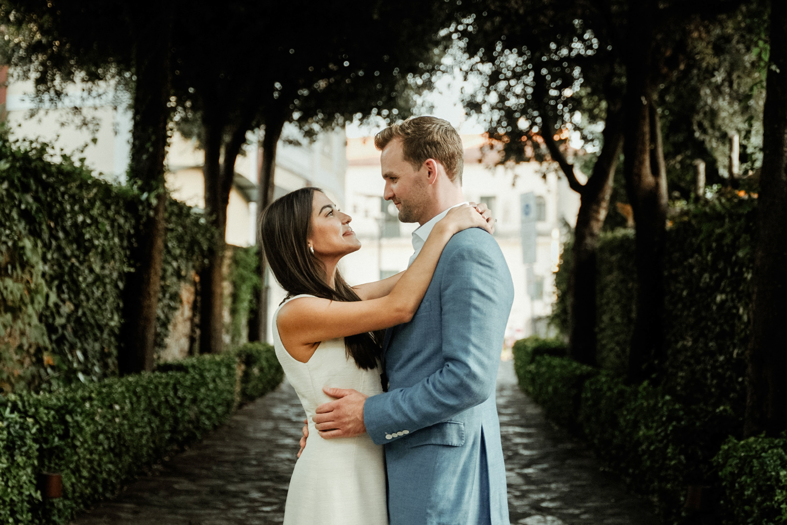 Palazzo Avino Wedding in Ravello - Luxury Celebration on the Amalfi Coast 1 A bride and groom hugging in the central square the day before their Palazzo Avino wedding in Ravello