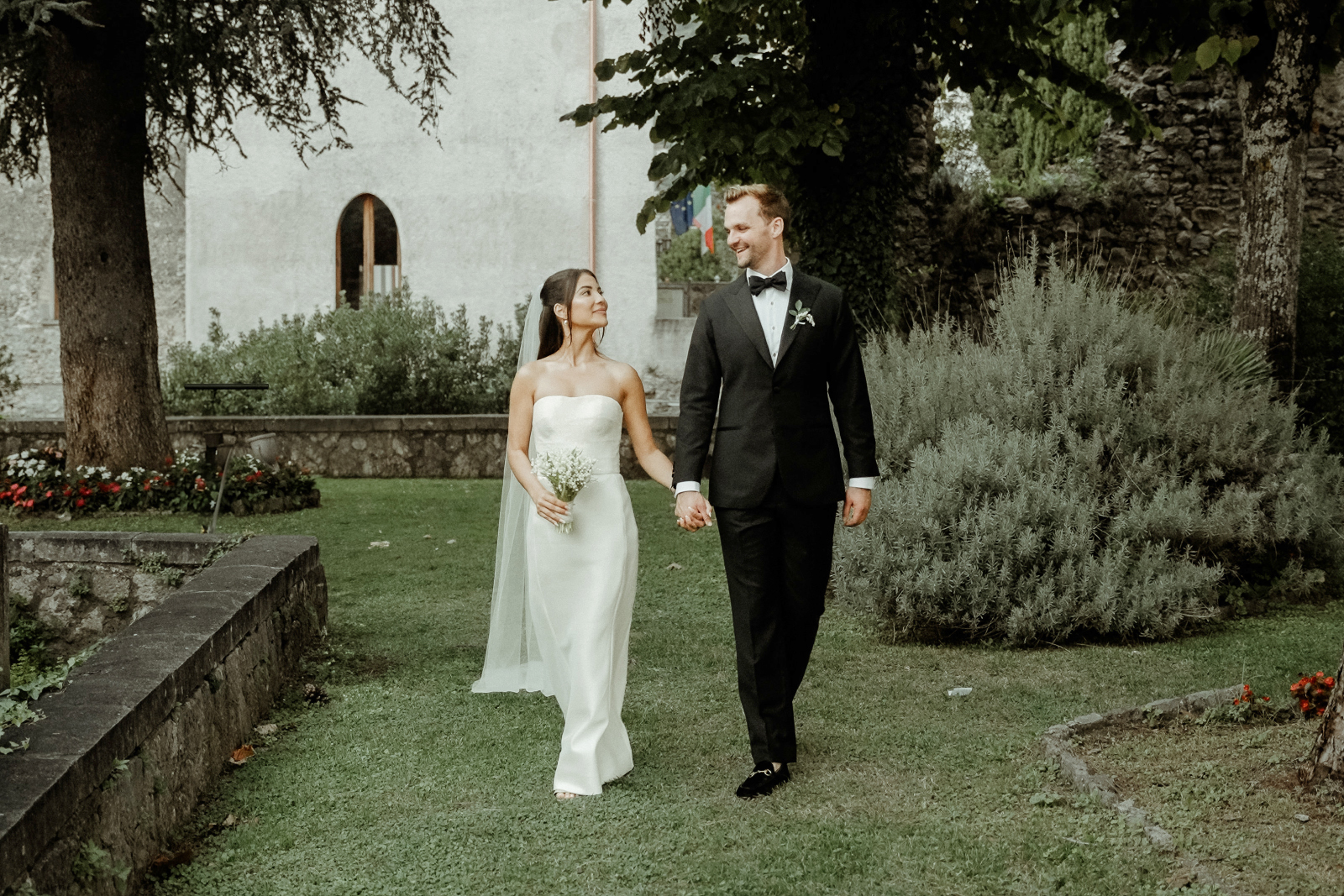 Bride and groom walking hand in hand after their Palazzo Avino Wedding in Ravello