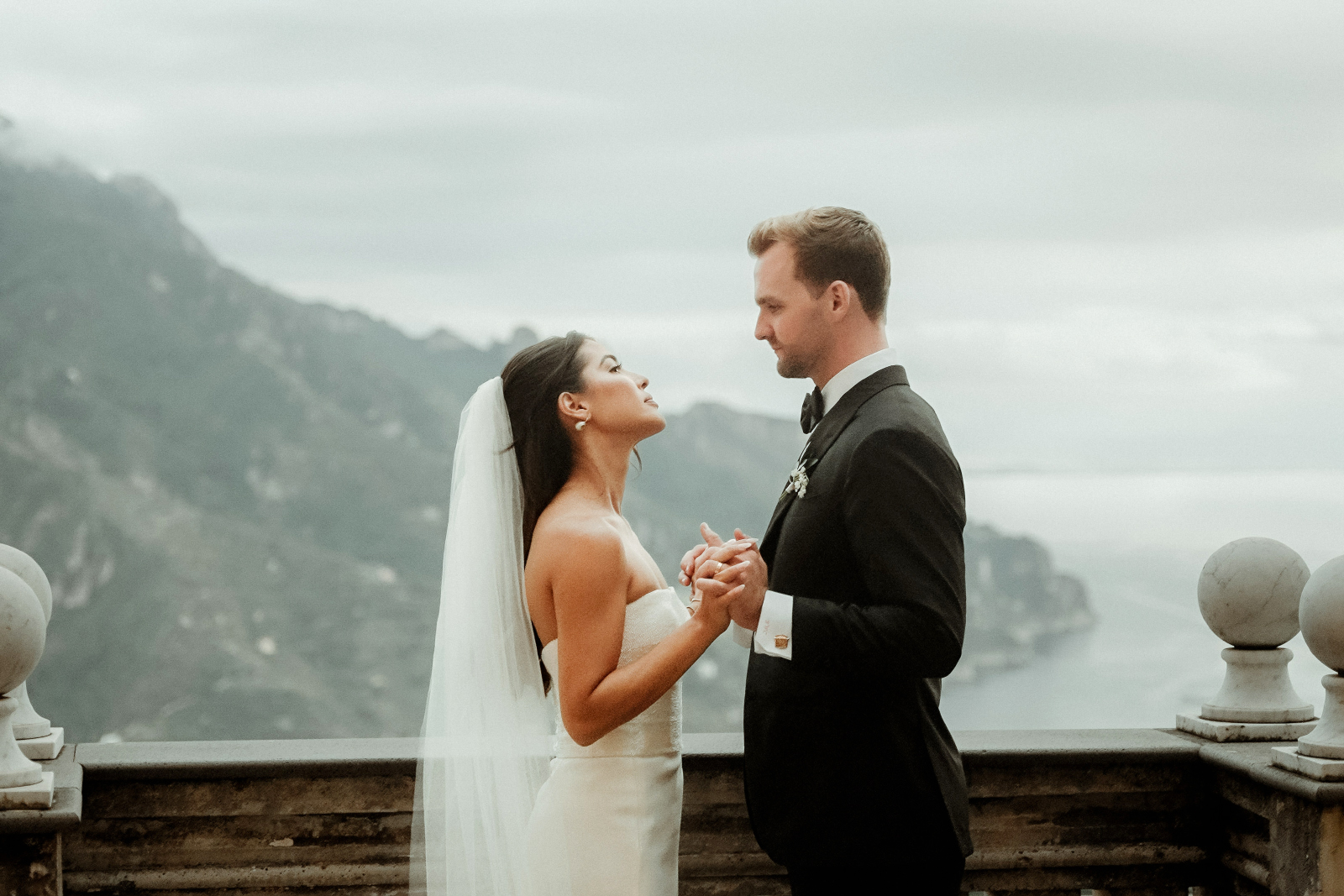 A bride and groom holding hands after their Palazzo Avino wedding in Ravello