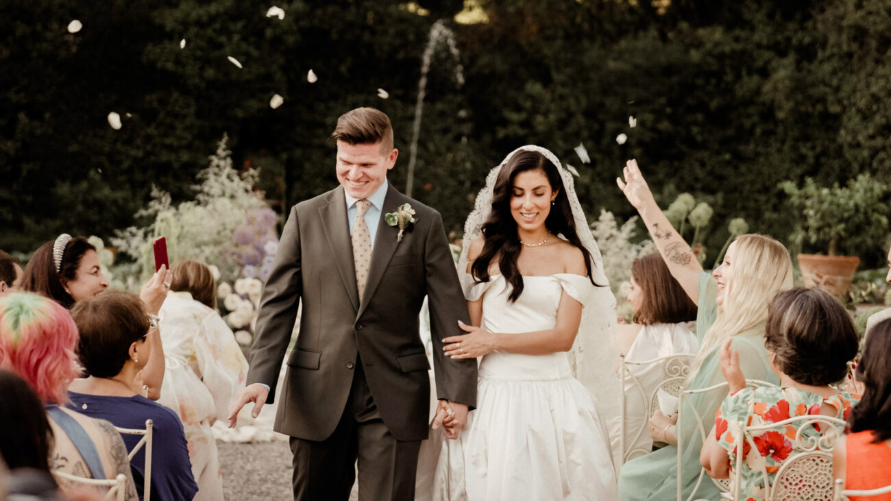 Couple Exit from a Persian Sofreh Aghd Wedding at Villa Grabau in Tuscany