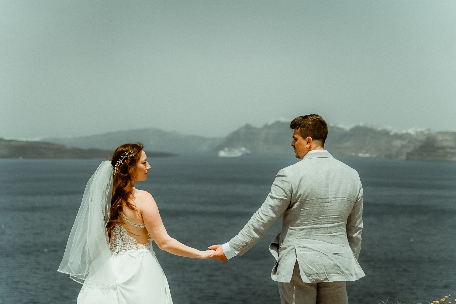 Santorini Wedding Videographer Filming a couple in Akrotiri Santorini