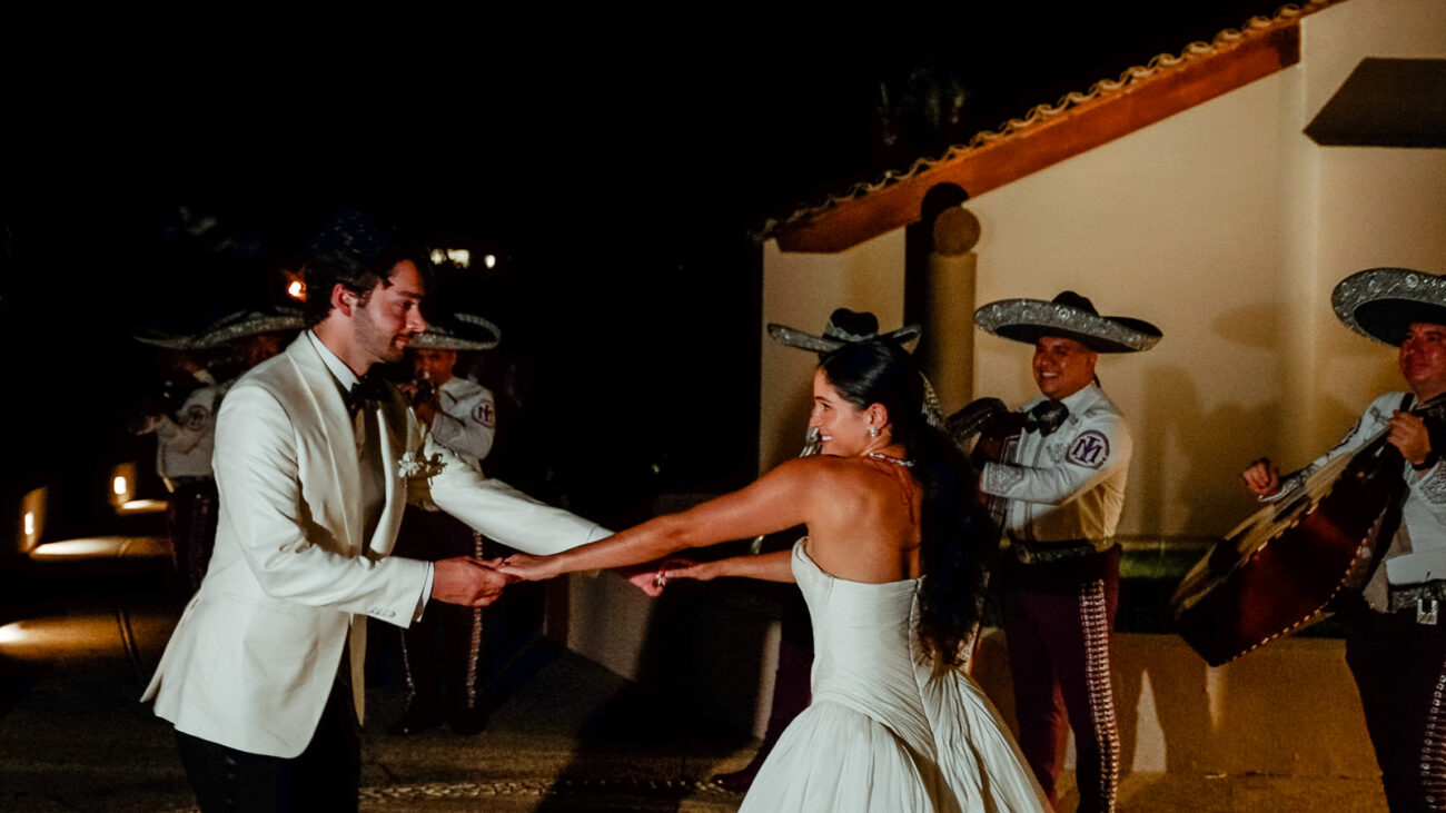 Wedding couple dances under the music of Mariachi filmed by a Mexico Wedding Videographer for Destination Weddings