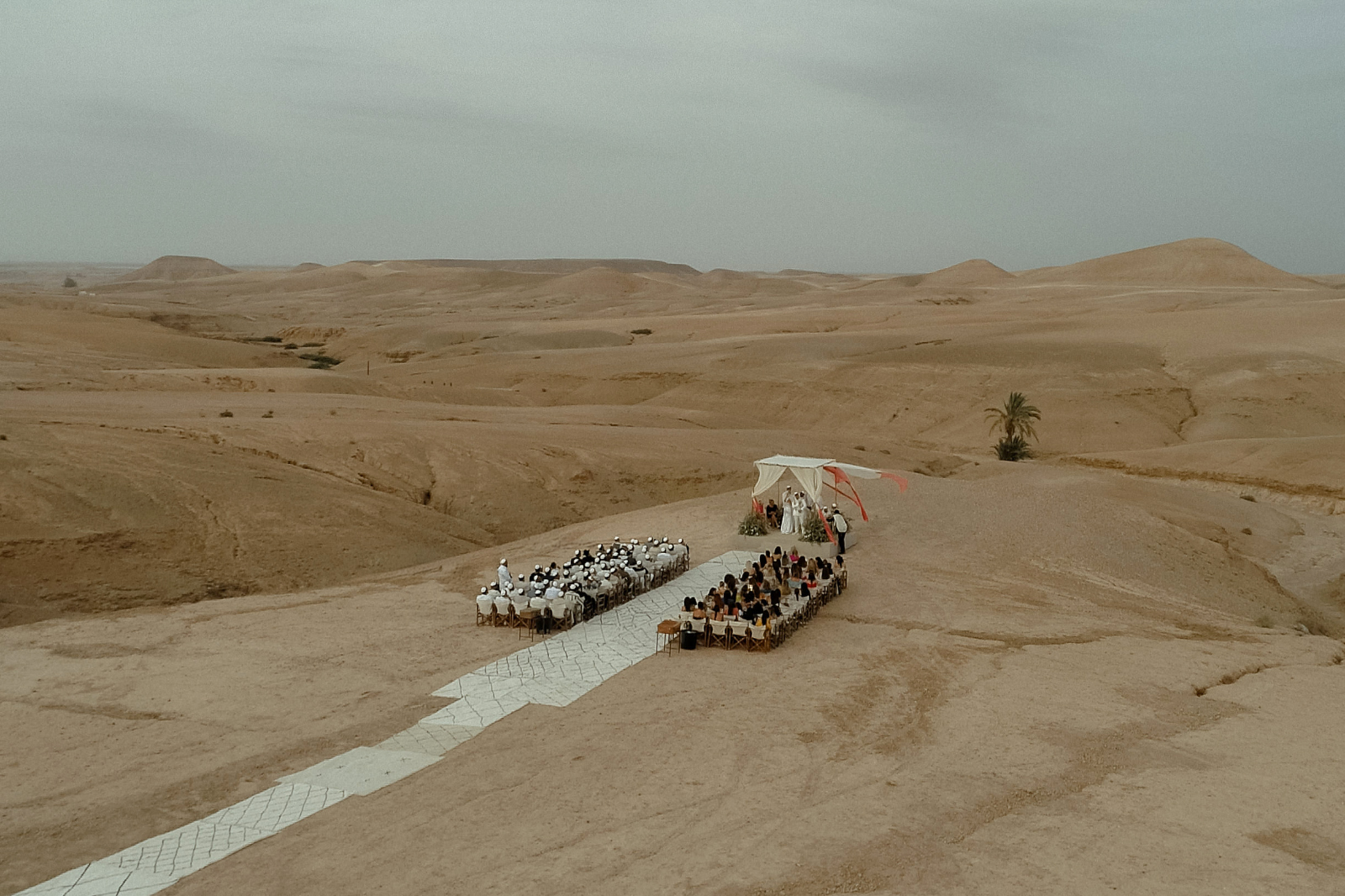 Aerial view of a Jewish Wedding ceremony setup in Marrakech Agafay desert at Scarabeo Camp