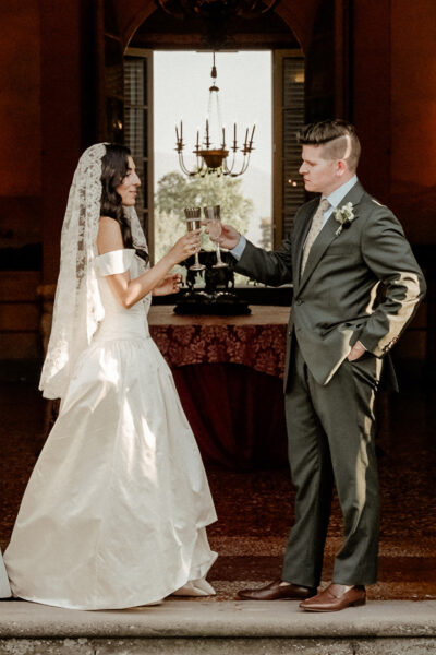 Italy Wedding Videographer for Destination Weddings 17 A Wedding Couple holding champagne glasses in Tuscany filmed by their Italy Wedding Videographer