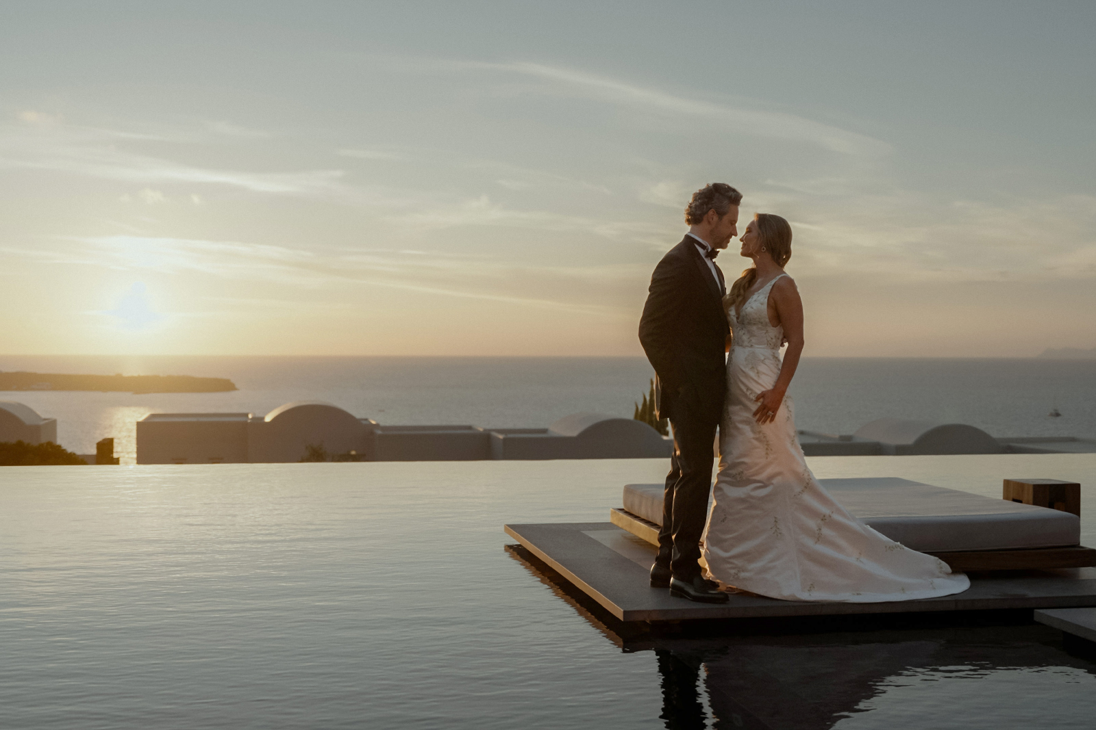 Destination Wedding Videographer - Bespoke Wedding Films Across Europe 9 Bride and groom sunset portrait afte their intimate Santorini Wedding at Canaves Epitome in Oia